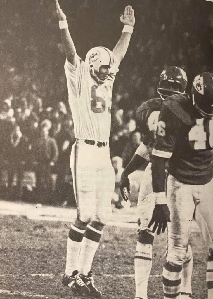 Karl Noonan with arm up.